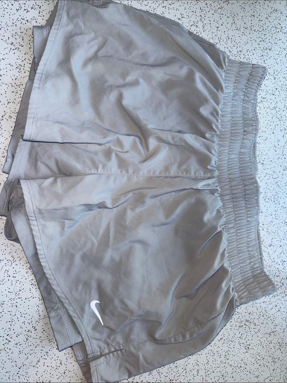 Nike Women’s Light Gray Athletic Shorts with White Swoosh